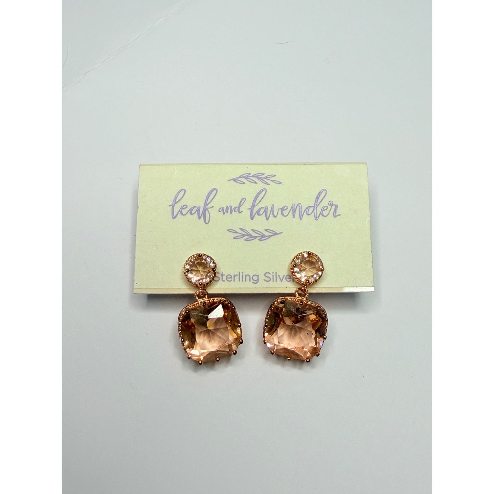 Leaf and Lavender brand earrings feature large, peach-colored silver. - Picture 4 of 5